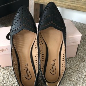 Black pointed-toe flats with lace cut-out detail